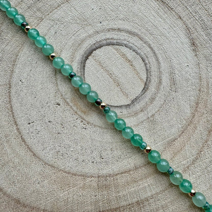 Green Aventurine Bracelet on a wooden background
