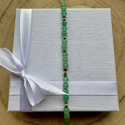 Vertical view of Green Aventurine Bracelet on gift packaging