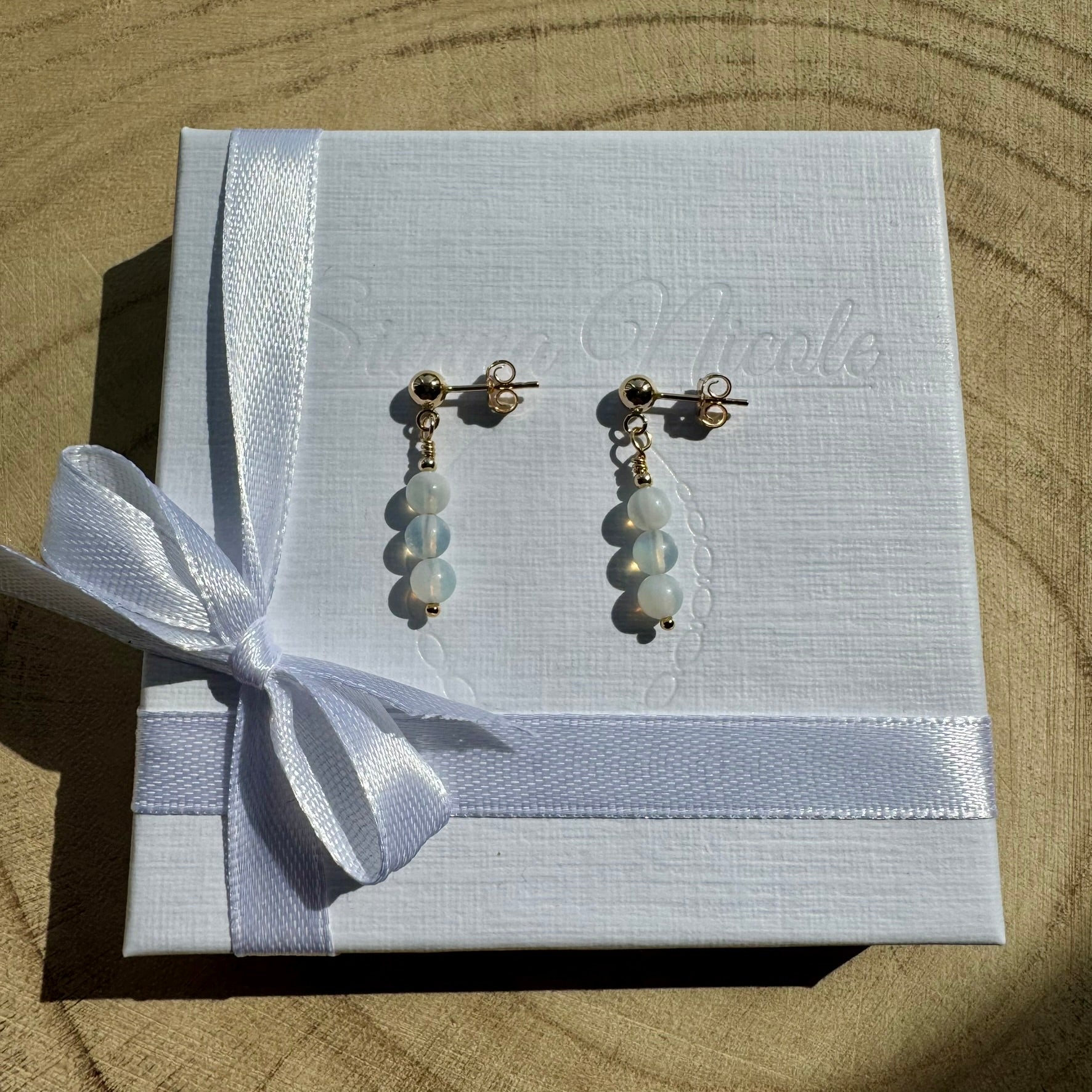 Pair of Gold Filled opalite earrings on white gift packaging