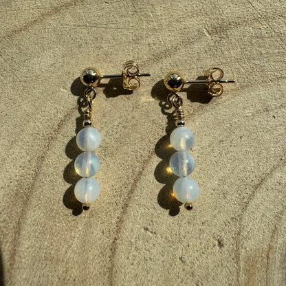 Pair of Gold Filled opalite earrings on wooden surface