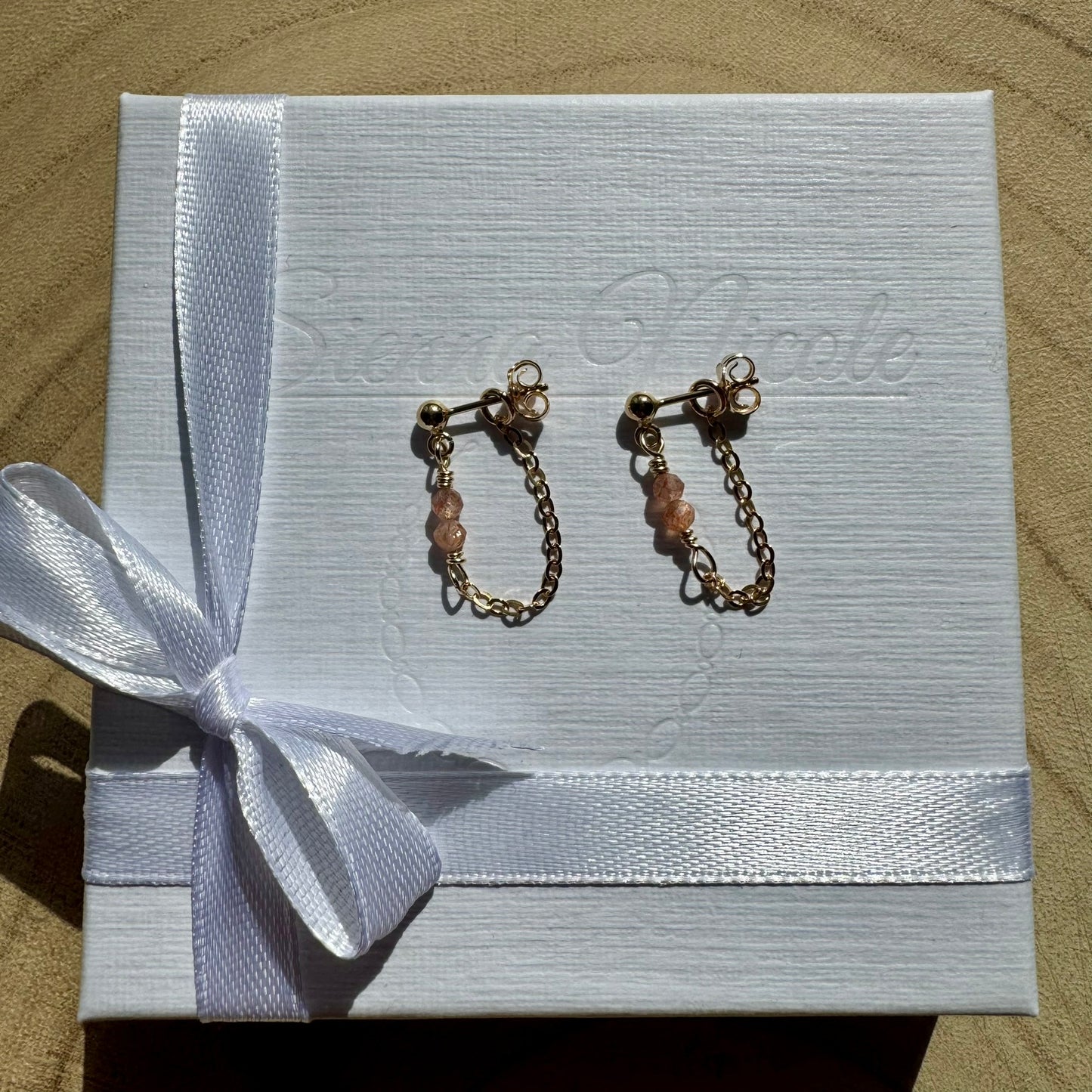 Gold filled chain and gemstone drop earrings on gift packaging