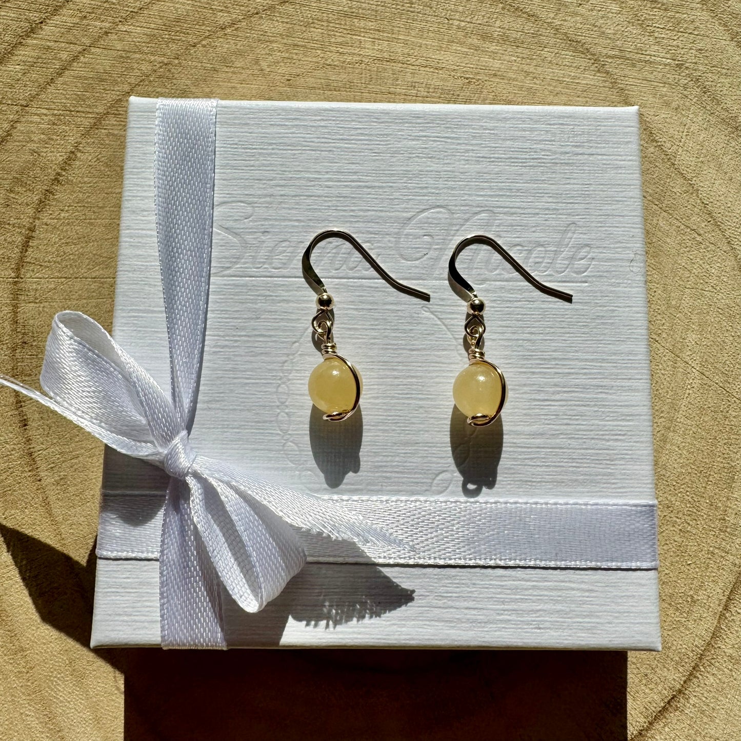 Gold filled and yellow aragonite gemstone drop earrings in a white gift box with ribbon