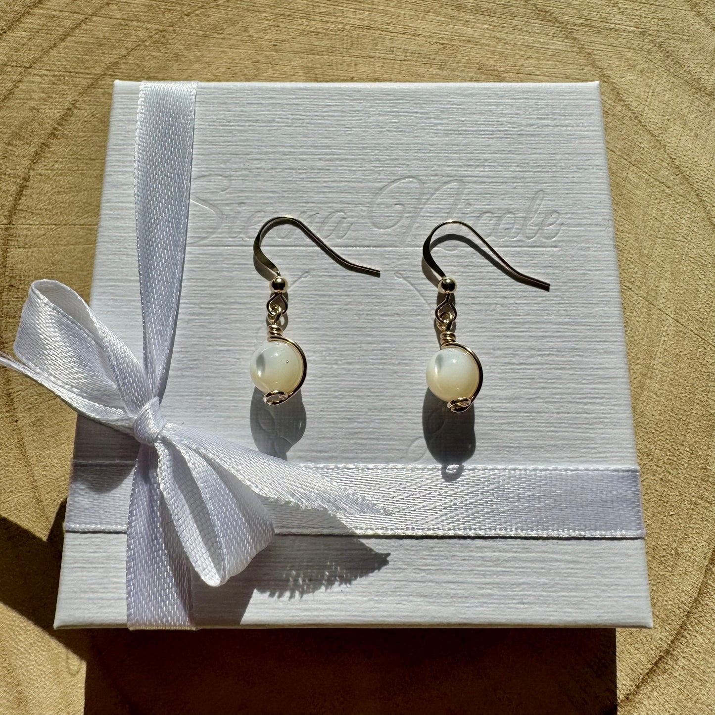 Gold filled and mother of pearl gemstone drop earrings in a white gift box with ribbon