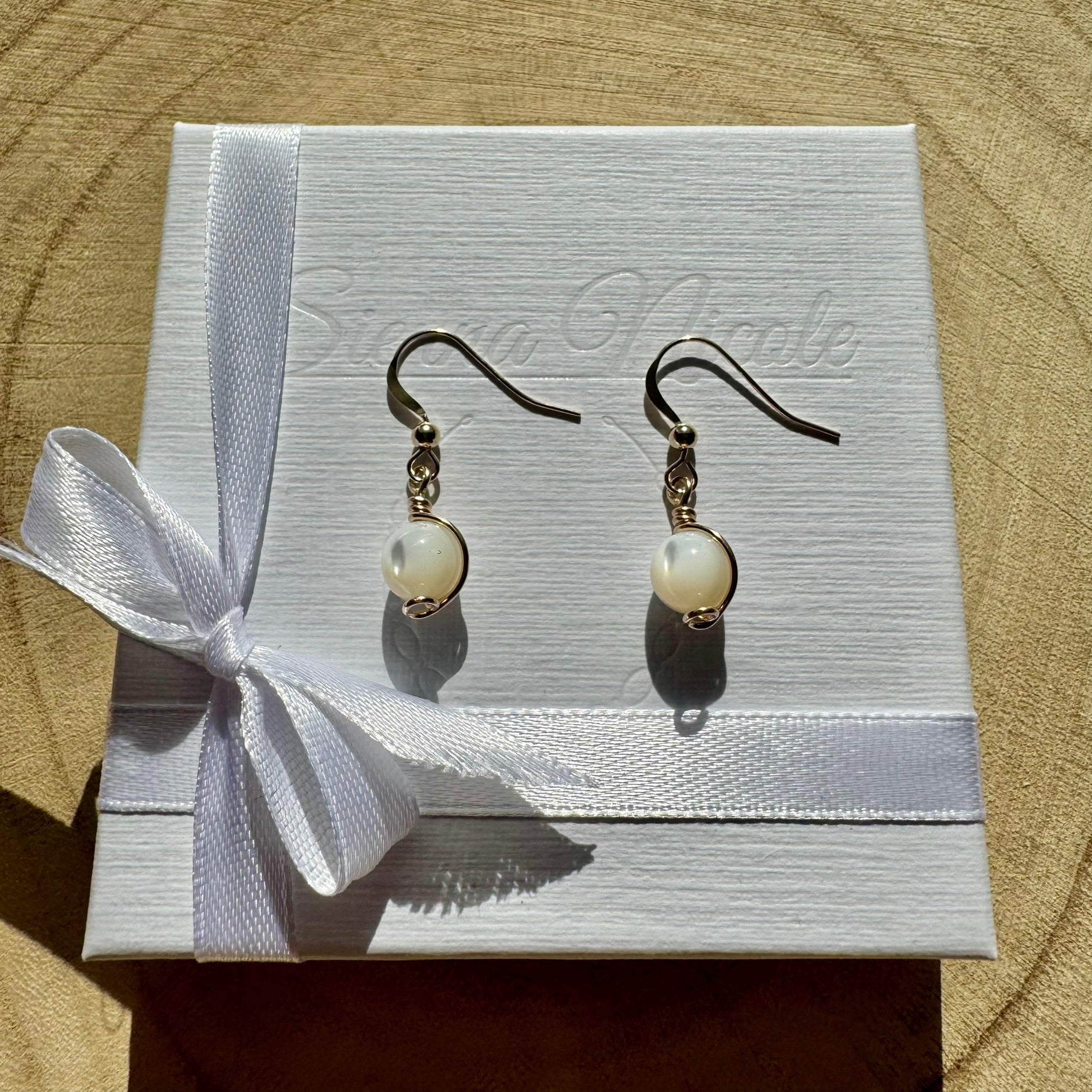 Gold filled and mother of pearl gemstone drop earrings in a white gift box with ribbon