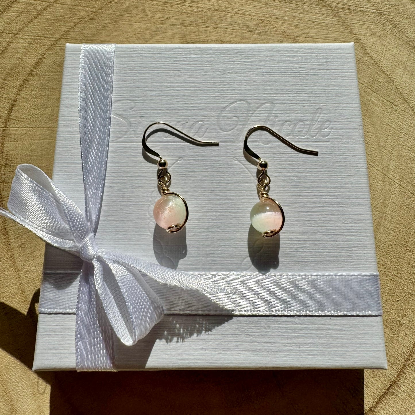 Gold filled and selenite gemstone drop earrings in a white gift box with ribbon