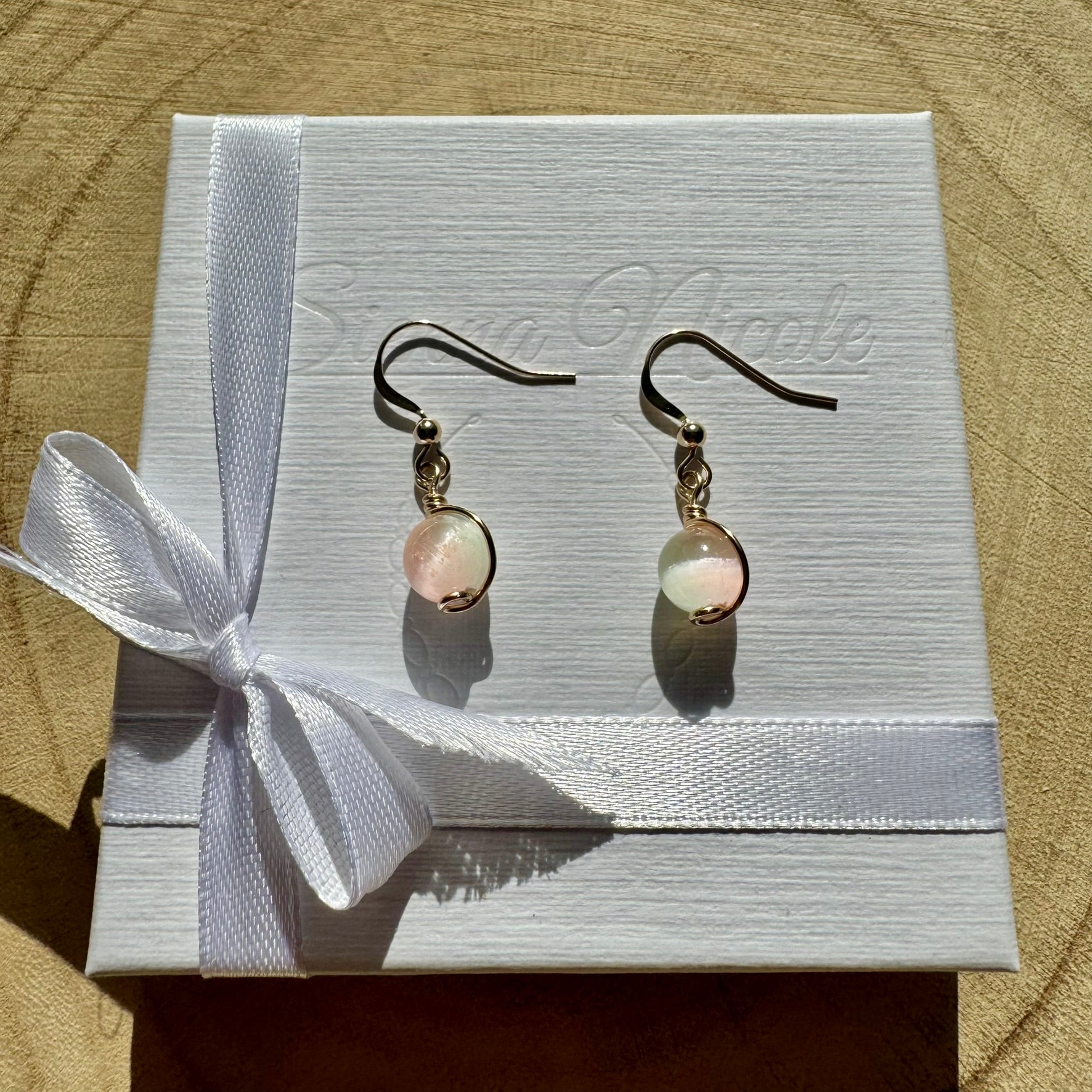 Gold filled and selenite gemstone drop earrings in a white gift box with ribbon