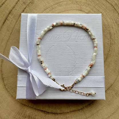 Mother of pearl and gold filled bracelet on a white gift box with ribbon