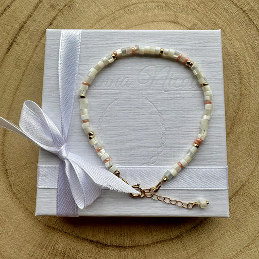 Mother of pearl and gold filled bracelet on a white gift box with ribbon