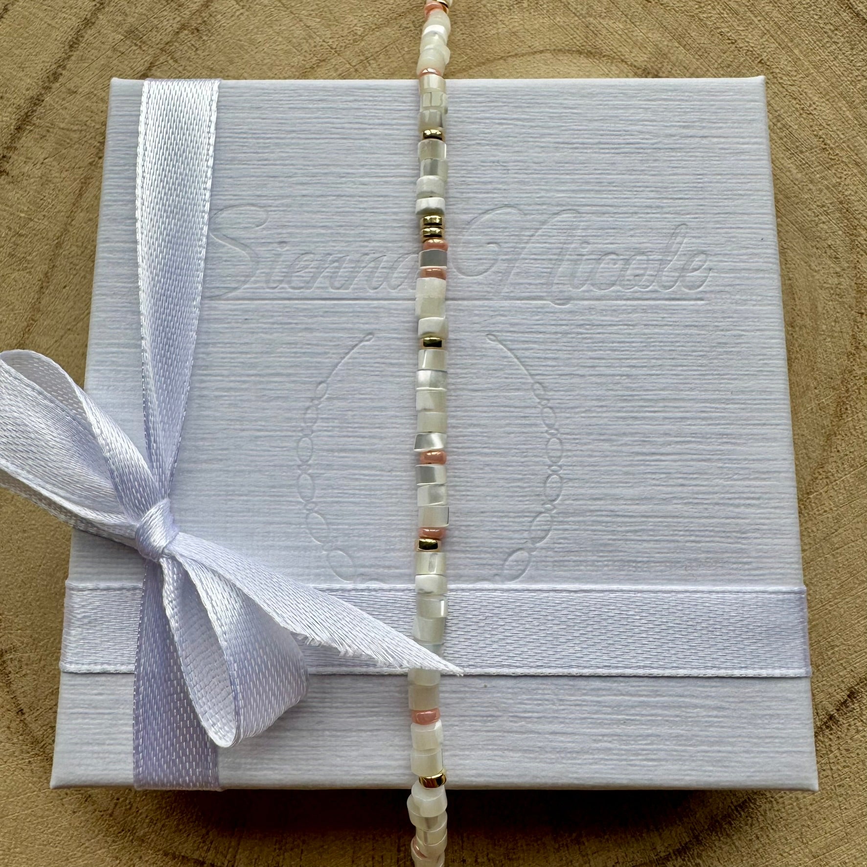 Mother of pearl gold filled bracelet, vertical view on gift packaging
