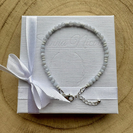 Pale Blue gemstone beaded bracelet on branded gift packaging