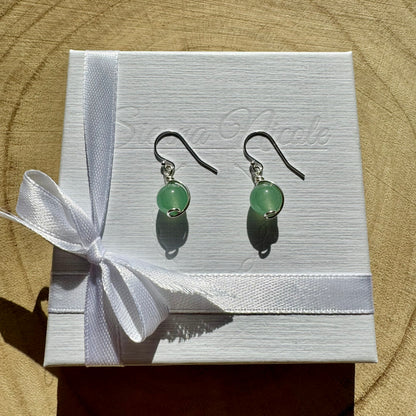 Sterling Silver and Green Aventurine Gemstone drop earrings on a white box with a white ribbon