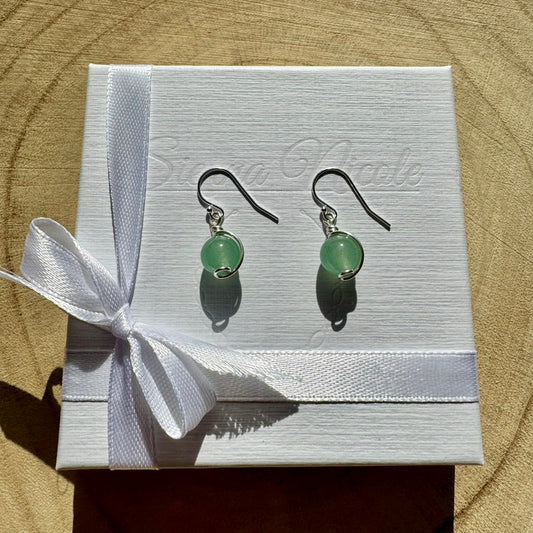 Sterling Silver and Green Aventurine Gemstone drop earrings on a white box with a white ribbon