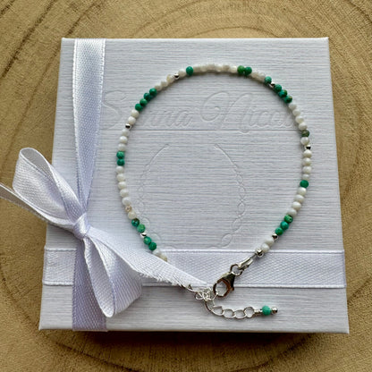 Mother of Pearl and Turquoise bracelet on a white gift box with a white ribbon