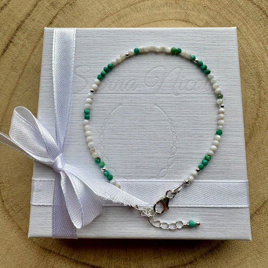 Mother of Pearl and Turquoise bracelet on a white gift box with a white ribbon