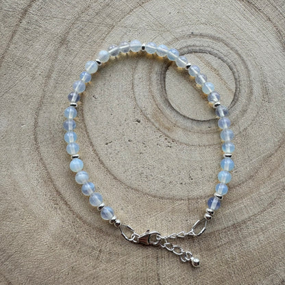Sterling silver opalite bracelet on wooden surface
